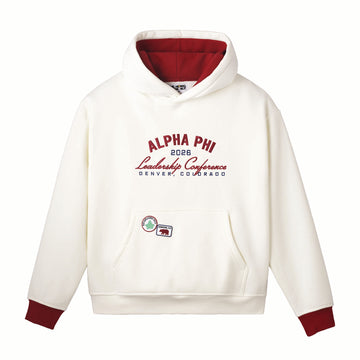 White hoodie with red accents featuring 'Alpha Phi 2026 Leadership Conference' text on a white background