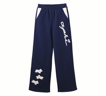 Navy blue pants with white designs and text on a white background