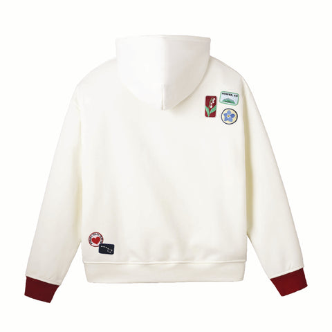 White hoodie with colorful patches on a white background