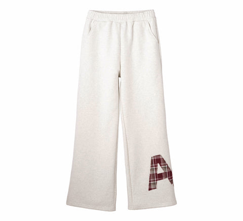 White sweatpants with a plaid letter 'A' on a white background