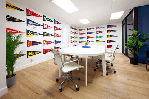 HLH office meeting room with university penants
